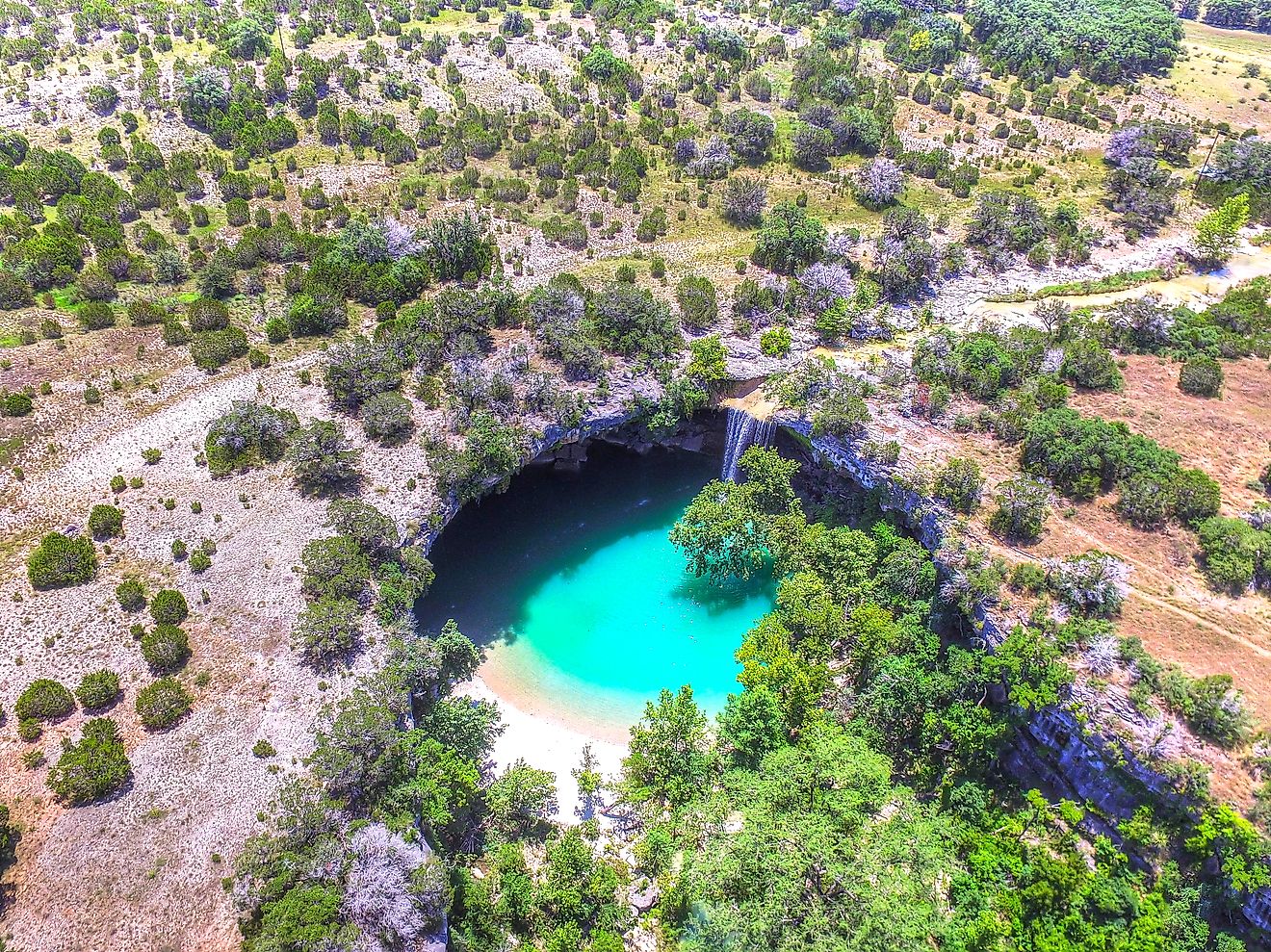 Aerial drone view of Hamilton Pool in Dripping Springs Texas.