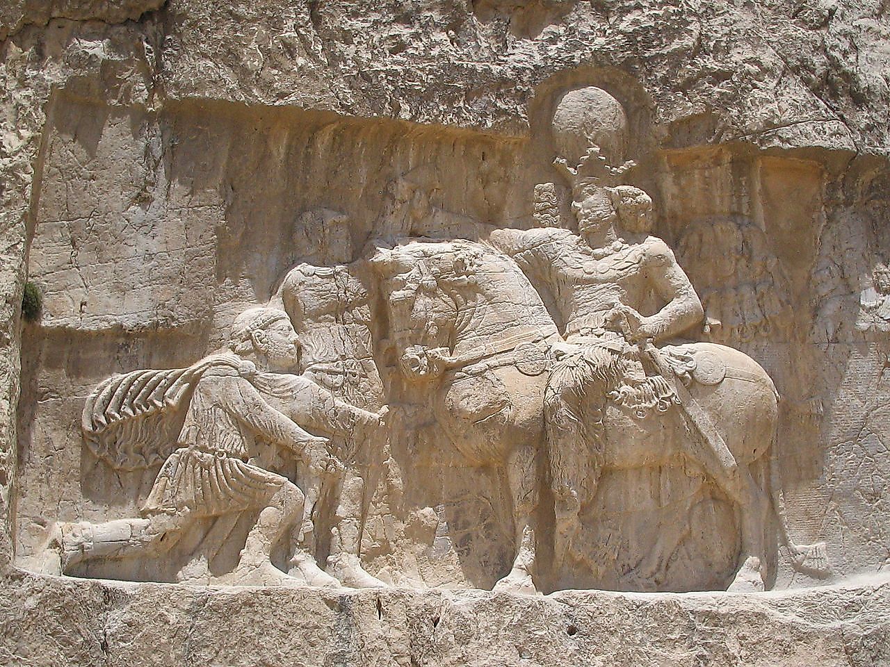 A rock-face relief at Naqsh-e Rostam, depicting the triumph of Shapur I over the Roman Emperor Valerian and Philip the Arab. Image credit: Fabienkhan/Public domain