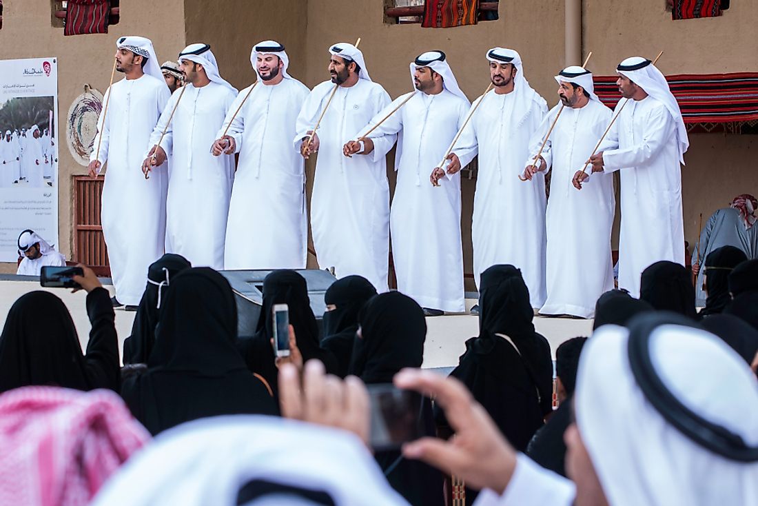 Men perform a traditional Saudi dance in Riyadh. Editorial credit: Ali Al-Awartany / Shutterstock.com. 