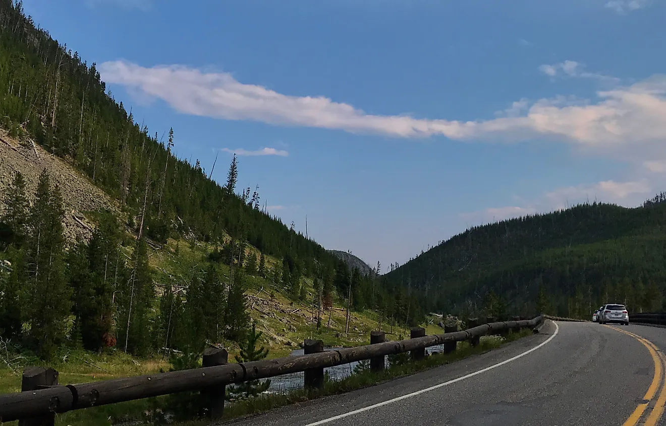 The Grand Loop Road in Yellowstone National Park is known as one of the first public use roads throughout a park. Credit: Helena Whitmore/ Shutterstock.com