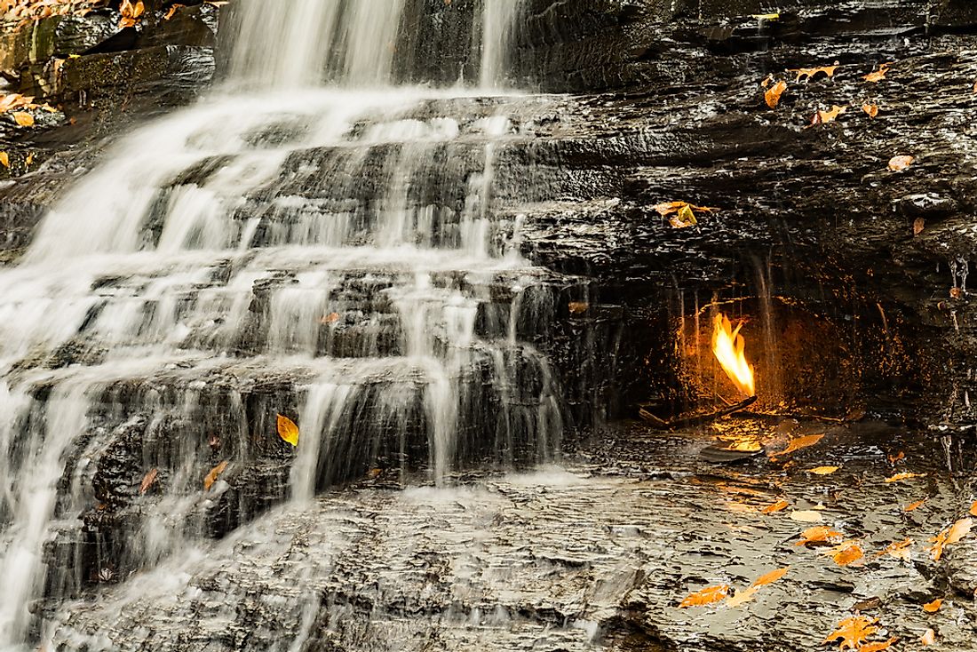 A natural-gas flame burns in a small grotto at the base of Eternal Flame Falls in Chestnut Ridge County Park.