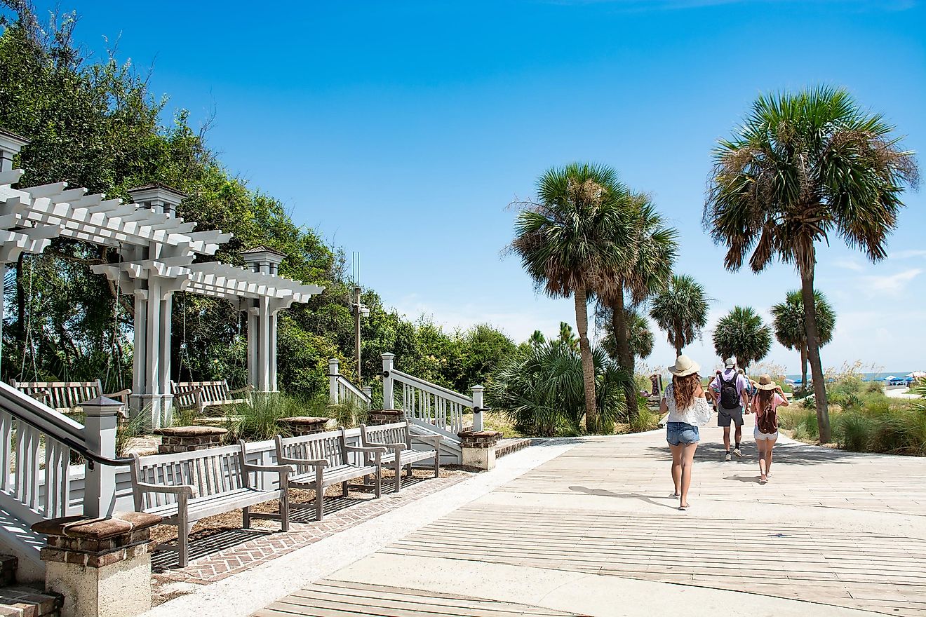 Family walking to the beach on summer vacation at Coligny Beach Park, Hilton Head Island, South Carolina, USA.