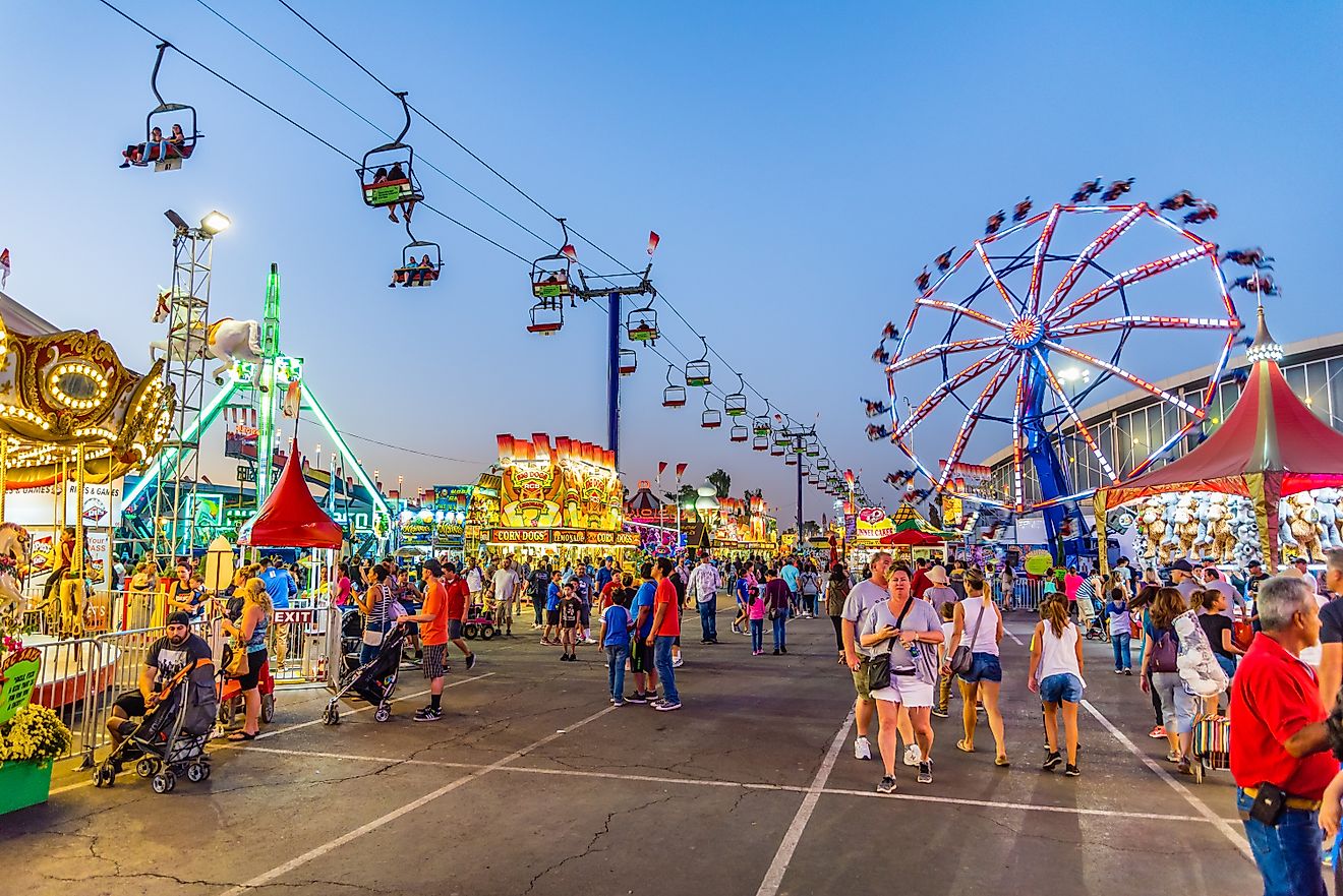 People stroll through the midway at the Arizona State Fair. By Gregory E. Clifford / Shutterstock.com