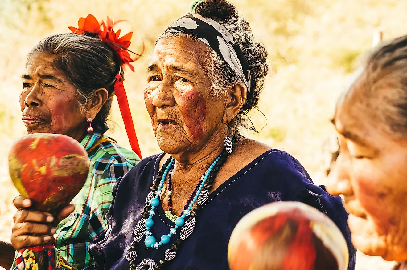 Paraguayan indigenous Guarani women perform a song. Image credit: Julian Peters Photography/Shutterstock.com