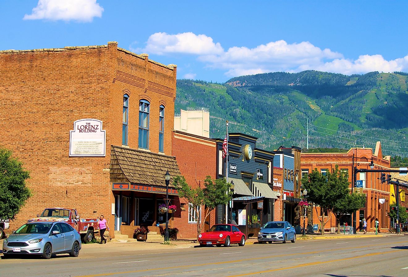 Vintage brick buildings with the ski resort on the mountains beyond taken in Steamboat Springs, Colorado. Image credit photojohn830 via Shutterstock