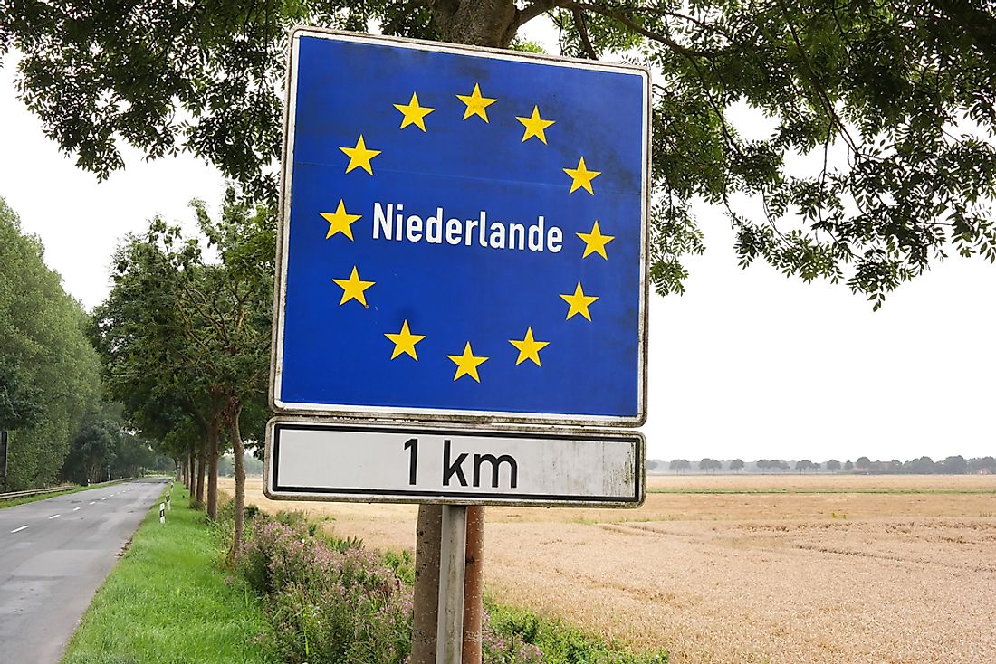 A sign showing the border of the Netherlands. 