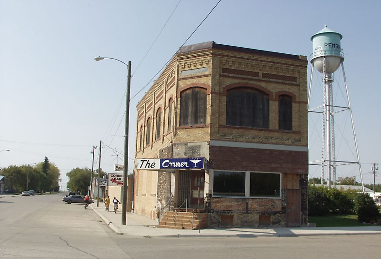 Historic building and water tower in Pembina, North Dakota. Image credit Andrew Filer from Seattle (ex-Minneapolis), CC BY-SA 2.0 <https://creativecommons.org/licenses/by-sa/2.0>, via Wikimedia Commons