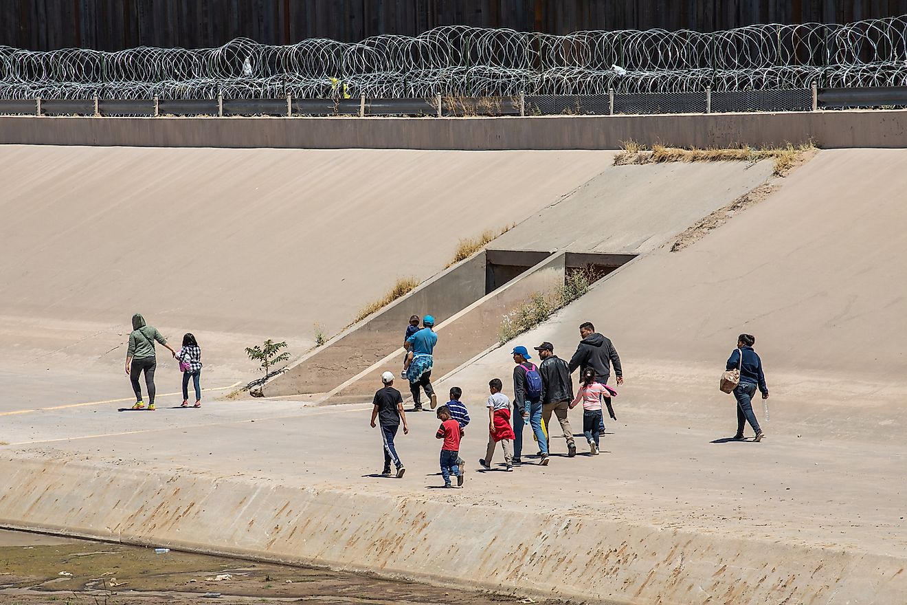 Migrants from Central America cross the US-Mexico border to seek asylum in the United States. Image credit: Mike Hardiman/Shutterstock.com