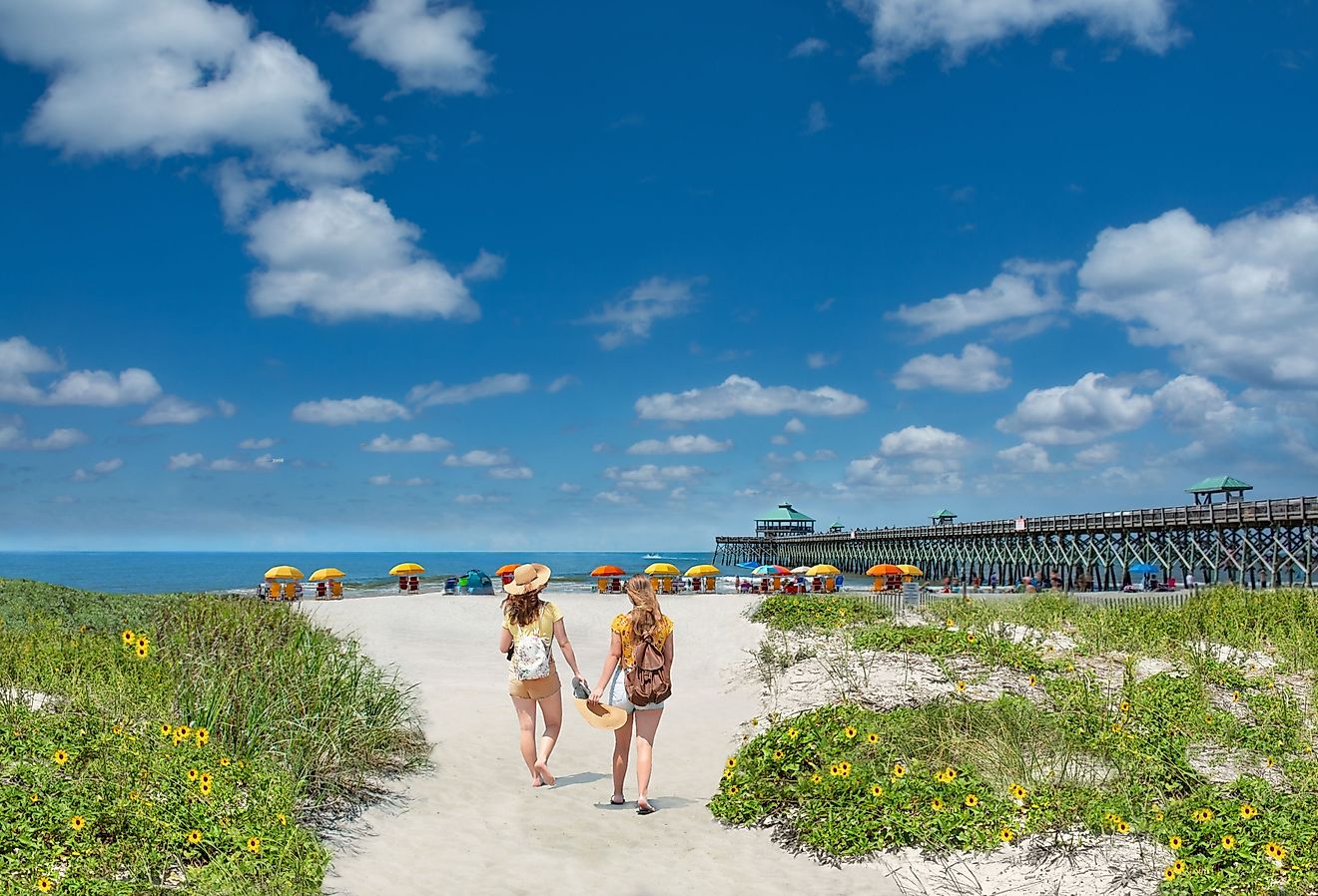 Girls walking on Folly Beach. South Carolina.