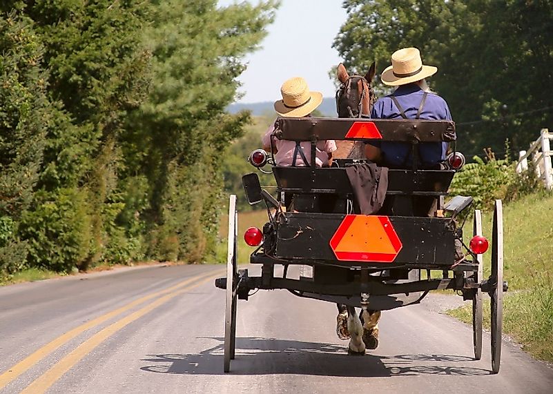 Old Order Amish, such as these in Lancaster, Pennsylvania, are associated with minimal utilization of modern technology, and thusly many travel by horse and buggy.
