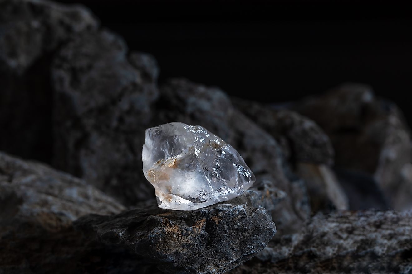 Natural rough diamonds on a pile of rocs close up photography.