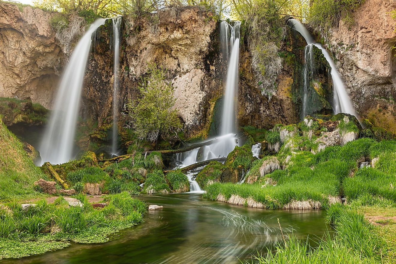 A long exposure of a triple falls at Rifle Falls in the lush springtime in Rifle Falls State park, Colorado