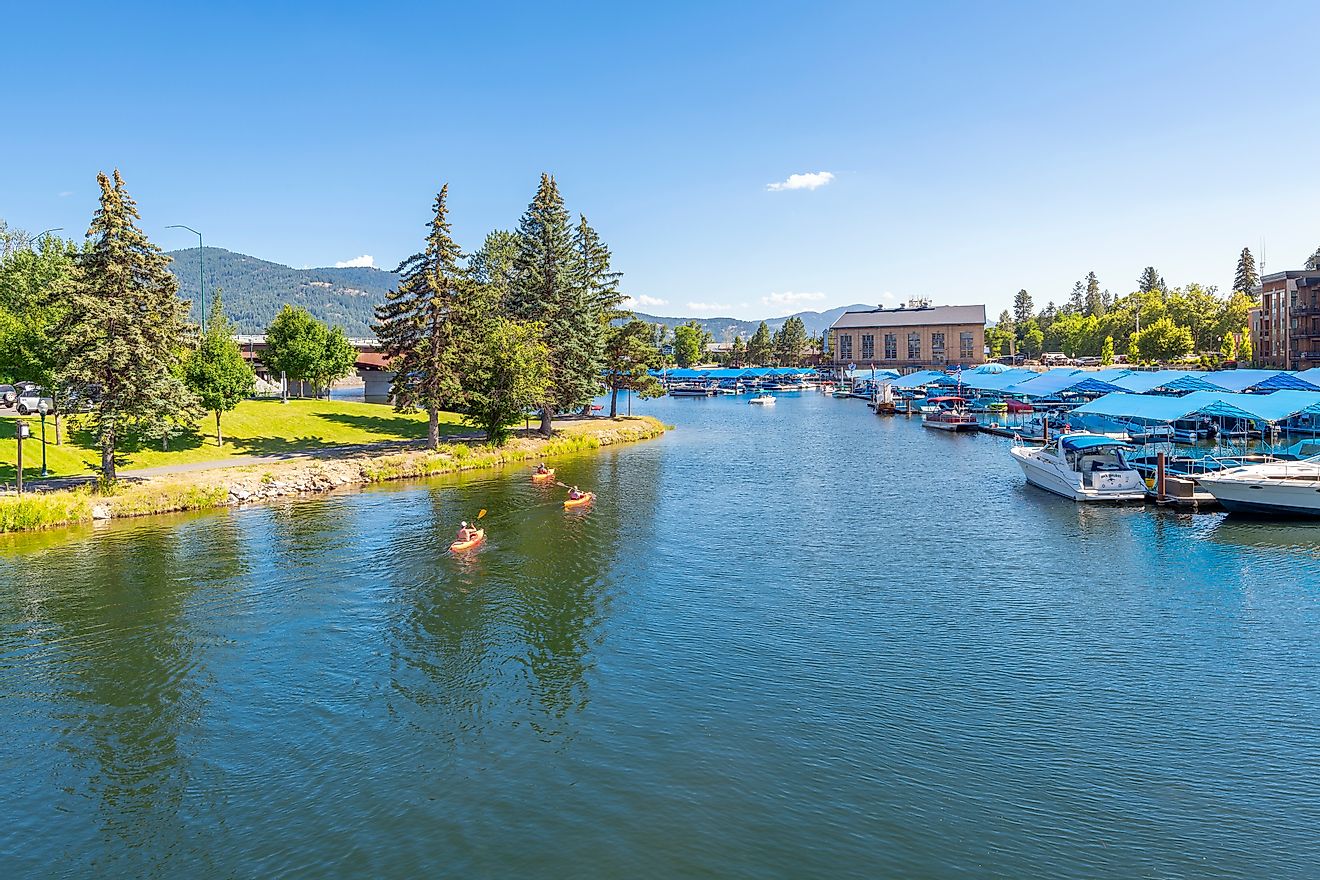 Sandpoint, Idaho: Kayakers enjoying a sunny summer day on Sand Creek alongside the marina and downtown at Lake Pend Oreille. Editorial credit: Kirk Fisher / Shutterstock.com