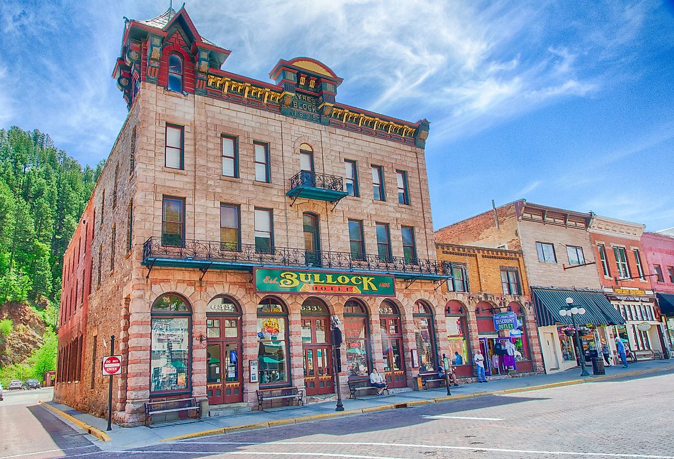 Tourists walk down main street in Deadwood, South Dakota outside the Bullock hotel. Image credit Gary C. Tognoni via Shutterstock