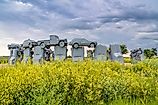 Carhenge with beautiful flowers near Alliance, Nebraska. Editorial credit: marekuliasz / Shutterstock.com