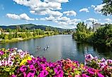 A group of kayakers enjoy a beautiful summer day on Sand Creek River and Lake Pend Oreille in the downtown area of Sandpoint, Idaho.