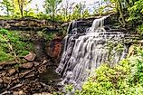 The mammoth waterfall is set amidst dense foliage and river rock at Cuyahoga Valley National Park in Ohio.