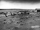 Buried machinery in a barn lot; Dallas, South Dakota, May 1936