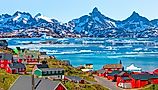 Picturesque village on coast of Greenland - Colorful houses in Tasiilaq, East Greenland