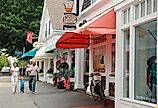 A young family walks through the charming Cape Cod town of Chatham, Massachusetts. Image credit James Kirkikis via Shutterstock