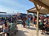 A mix of locals and visitors gather at East Channel Brewing CO’s outdoor patio to register for the Grand Island Marathon and carbo-load with wood-fired pizza. Image credit: Andrew Douglas