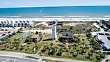 The beautiful coastline with beachside homes and a lighthouse at St. George Island.