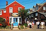 Folks stroll around the unique shops and boutiques on Bearskin Neck in Rockport, Massachusetts. Image credit James Kirkikis via Shutterstock