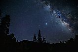 The Milky Way rises above Colorado's San Juan Mountains.