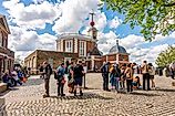 London, UK: Tourists standing on Greenwich meridian in Royal Observatory