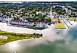 Chincoteague Island, marinas, houses and motels with parking lots.