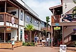 People in downtown Koloa Village, Kauai, Hawaii. Image credit bluestork via Shutterstock 