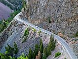 A lone vehicle drives along the dangerous Million Dollar Highway at Ouray, Colorado