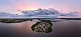 Panoramic aerial view of the Indian River Lagoon at sunrise with Wabasso Island and the Vero Beach coastline in Florida.