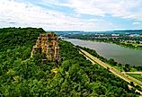 Sugar Loaf Bluff and the highway and lake in Winona, Minnesota during the summer.