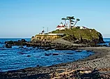 Battery Point Lighthouse in Crescent City, California, USA, during a low tide, in the early morning.