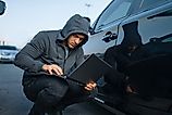 Car thief with laptop hacking alarm system