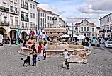 People visit Giraldo Square (Praca do Giraldo) in Evora, Portugal. Image credit: Tupungato via Shutterstock