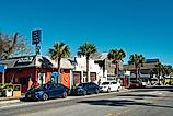 Pedestrians walk in downtown Folly Beach, South Carolina