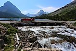 Red Tour Bus passing through the Glacier National Park, Montana.