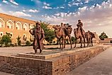 Sculpture group of an ancient caravan with camels carrying various goods along the Silk Road. 
