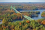 Thousand Islands Bridge across St. Lawrence River in fall in Thousand Islands National Park.