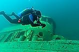 Diver exploring a shipwreck in Grand Island Harbor Bay, Lake Superior. 
