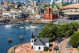 Cardiff, Wales: Aerial drone view of Cardiff Bay showing the Norwegian Church and Pierhead Building.