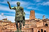 Statue of Emperor Trajan in the Trajan’s Market in via dei fori imperiali, Rome Italy. Via Shutterstock / Only Fabrizio