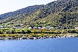 Charming houses sit near the Grey River in Greymouth, New Zealand.