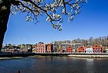View from the Westport Bridge over Saugatuck River and architecture near downtown. Image credit Miro Vrlik Photography via Shutterstock.