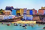 Beautiful summer sunshine and warm weather drew visitors to the beach Tenby, Wales. Editorial credit: Lukasz Pajor via Shutterstock.com
