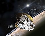Artist’s concept of the New Horizons probe flying through the Pluto-Charon system in July 2015. Johns Hopkins University Applied Physics Laboratory/Southwest Research Institute, Public domain, via Wikimedia Commons