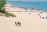Beach scene on a sunny day at Indiana Dunes State Beach, Lake Michigan. Image credit HPK Images via Shutterstock