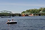 View from the river of the Rocks Village Bridge, which crosses the Merrimack River at West Newbury, Massachusetts, By kathryn from New York City - IMG_2014, By kathryn from New York City - IMG_2014, CC BY 2.0, https://commons.wikimedia.org/w/index.php?cur